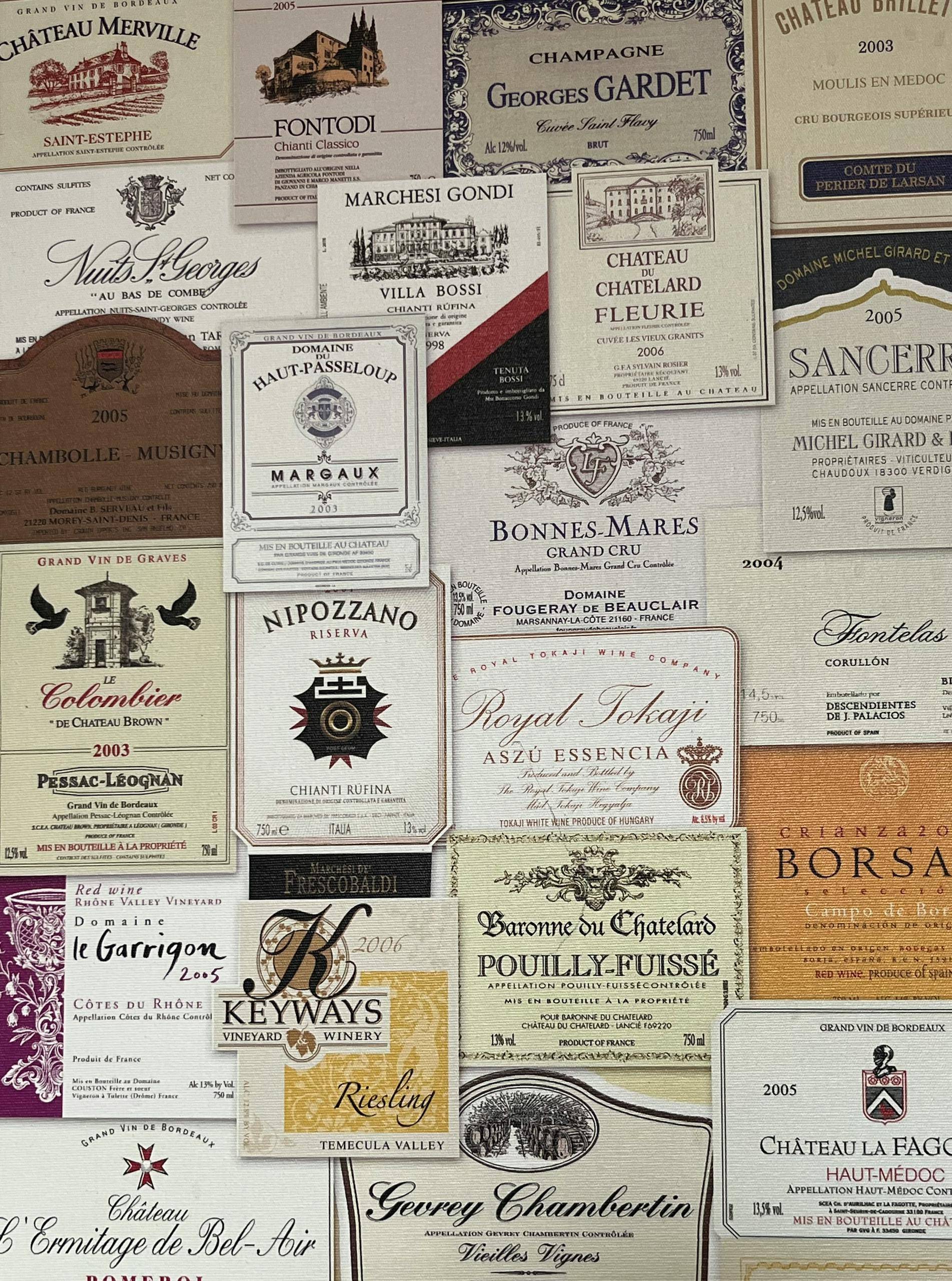An assortment of vintage wine labels showcasing diverse styles and origins.